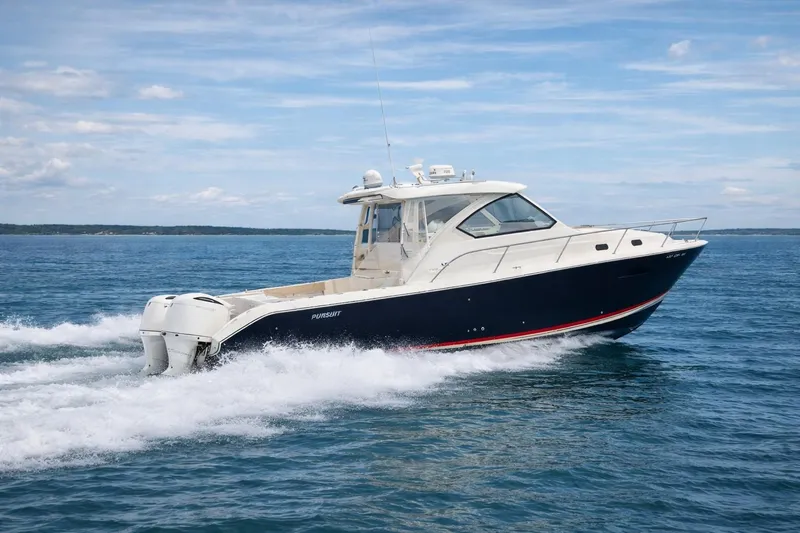 The Image of 2017 Pursuit OS 355 Offshore boat cruising on open water under a clear sky. - 0