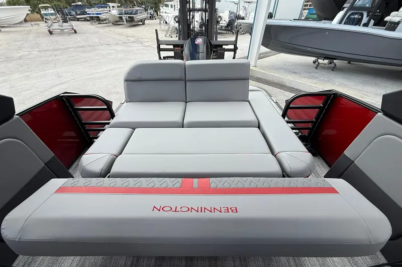 Slide: The Image of 2026 Bennington 26 M Center Swingback boat interior with luxurious seating and modern design. - 11