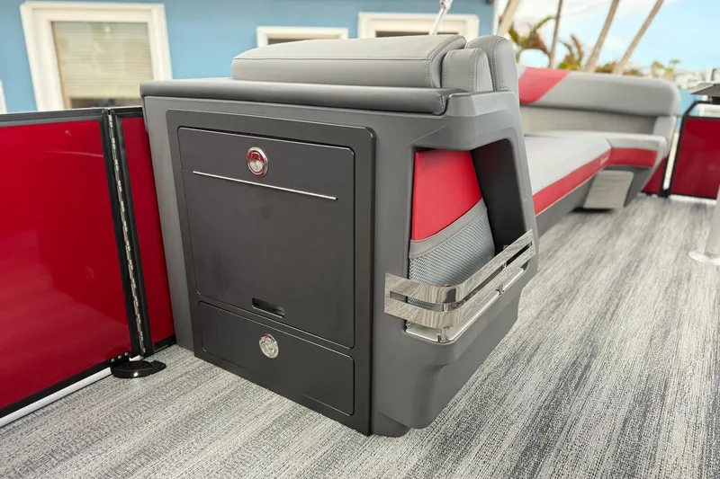 Slide: The Image of 2026 Bennington 26 M Center Swingback interior with sleek seating and storage. - 16