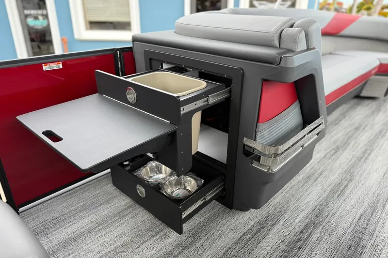 Slide: The Image of 2026 Bennington 26 M Center Swingback with pull-out storage and seating, featuring modern design. - 17