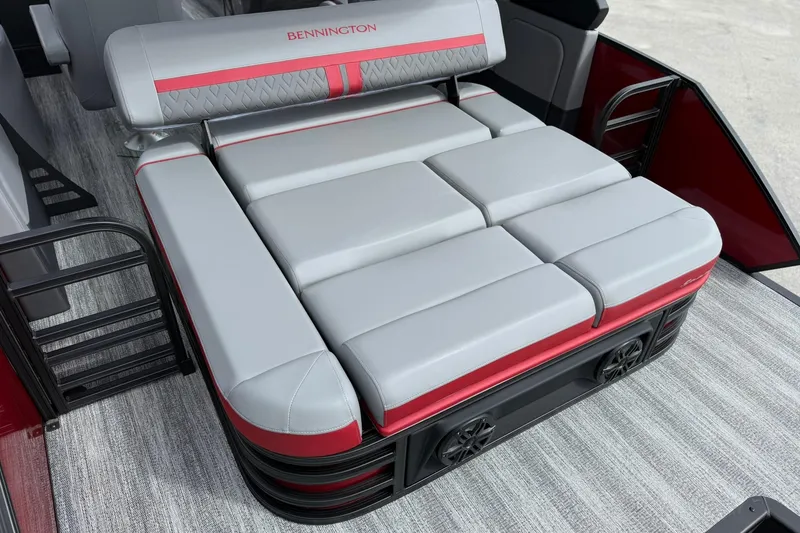 Slide: The Image of 2026 Bennington 26 M Center Swingback boat seat with red and gray upholstery. - 6