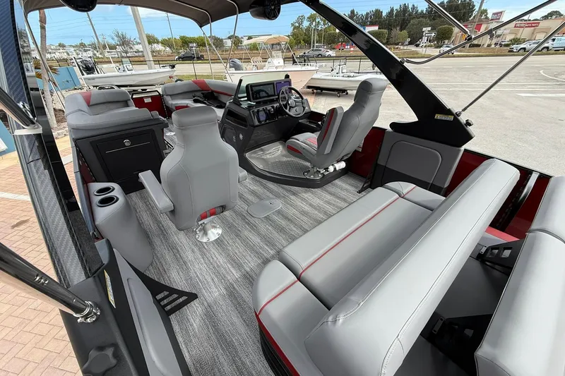 Slide: The Image of 2026 Bennington 26 M Center Swingback boat interior with modern seating and helm. - 8