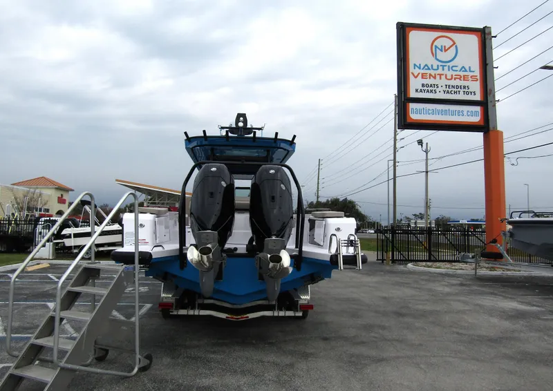 Slide: The Image of 2024 Axopar 37 Sun Top boat displayed at Nautical Ventures dealership. - 5