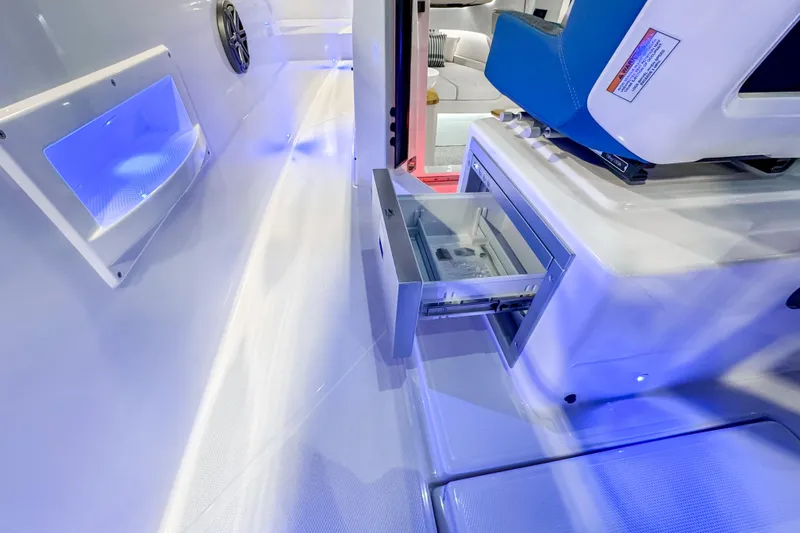 Slide: The Image of Interior of 2025 Axopar 37 Sun Top BRABUS Trim with open storage drawer. - 25