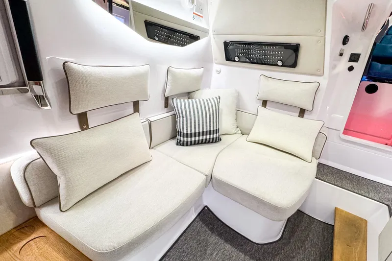 Slide: The Image of Luxurious seating area in 2025 Axopar 37 Sun Top BRABUS Trim boat interior. - 31