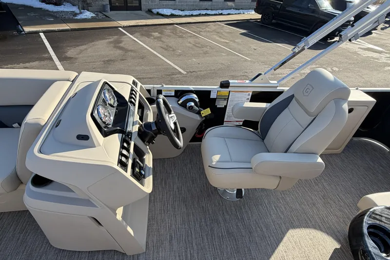 Slide: The Image of 2026 Godfrey Sweetwater 2086 C boat interior with steering console and captain's chair. - 14