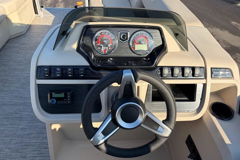 Slide: The Image of 2026 Godfrey Sweetwater 2086 C boat dashboard with steering wheel and control panel. - 15