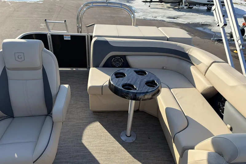 Slide: The Image of 2026 Godfrey Sweetwater 2086 C pontoon boat interior with seating and cupholder table. - 16
