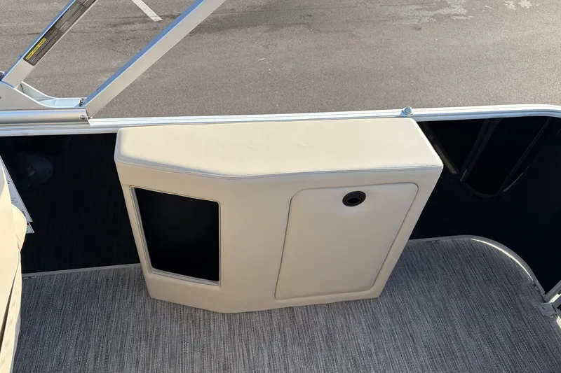 Slide: The Image of Interior view of 2026 Godfrey Sweetwater 2086 C boat with beige seating and carpeted flooring. - 20