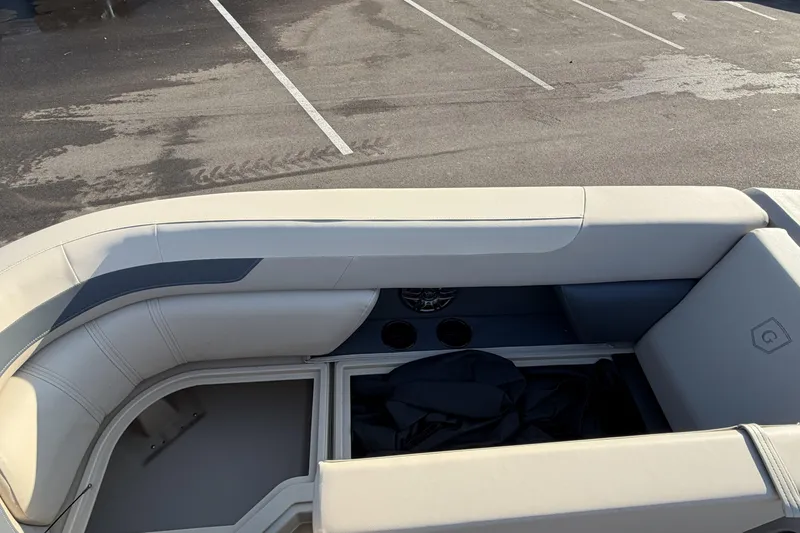 Slide: The Image of 2026 Godfrey Sweetwater 2086 C boat interior with beige seating and storage compartments. - 21