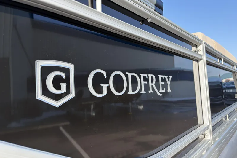 Slide: The Image of Close-up of 2026 Godfrey Sweetwater 2086 C logo on boat exterior. - 22