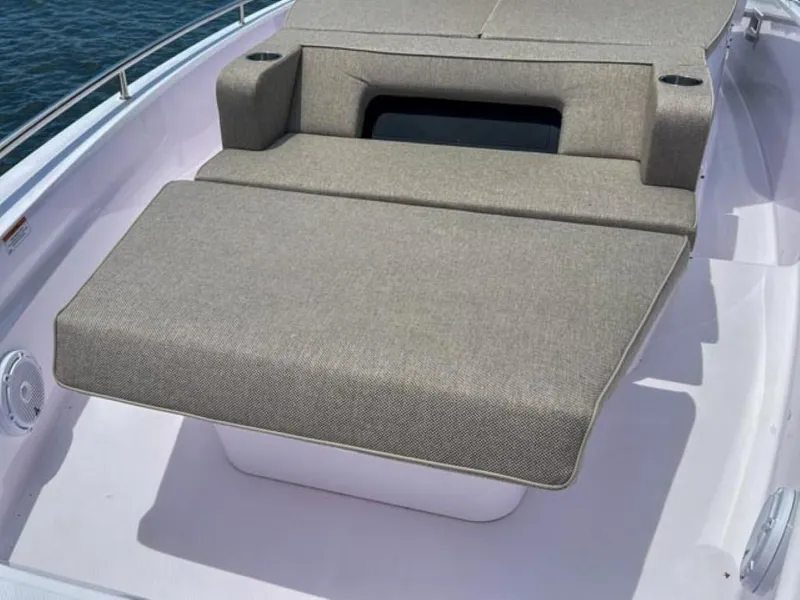 Slide: The Image of 2024 Axopar 37XC CROSS CABIN sunbed on deck, featuring comfortable seating. - 18