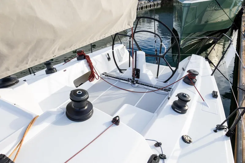 Slide: The Image of 2008 J Boats J/122 sailboat cockpit with steering wheel and winches. - 11