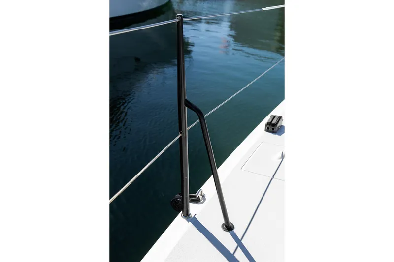 Slide: The Image of 2008 J Boats J/122 deck detail with railing and water reflection. - 19