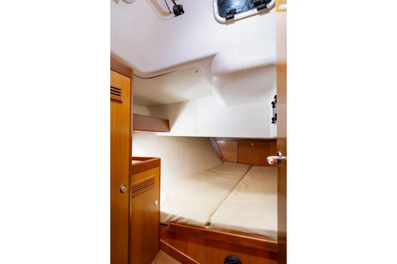 Slide: The Image of 2008 J Boats J/122 interior with navigation station and cozy cabin space. - 29