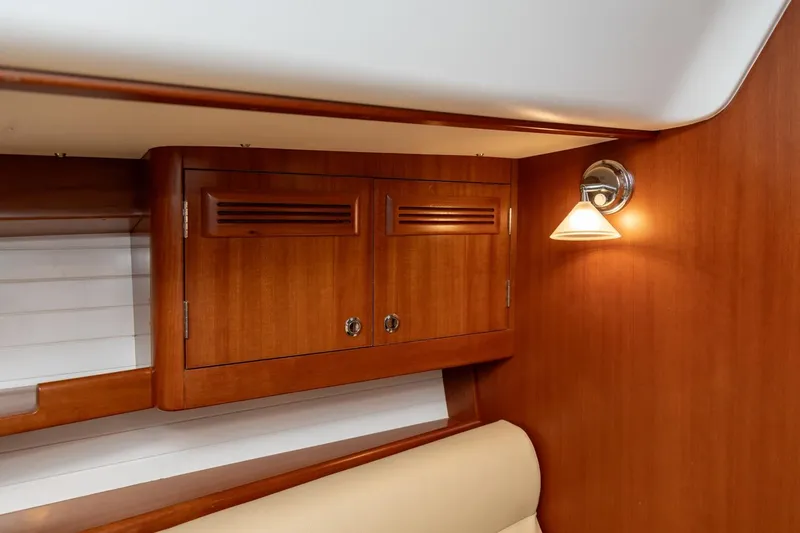 Slide: The Image of 2008 J Boats J/122 cabin interior with wooden finish and comfortable bedding. - 31