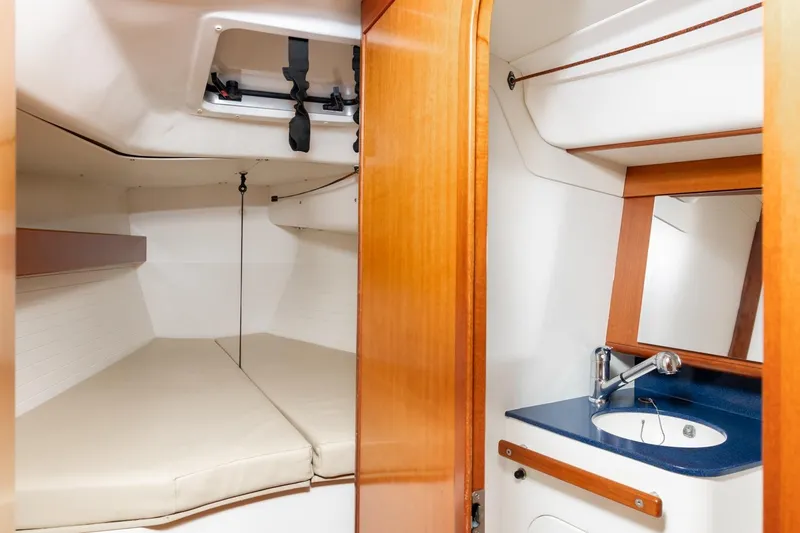 Slide: The Image of 2008 J Boats J/122 interior with wooden door and cabinets. - 36