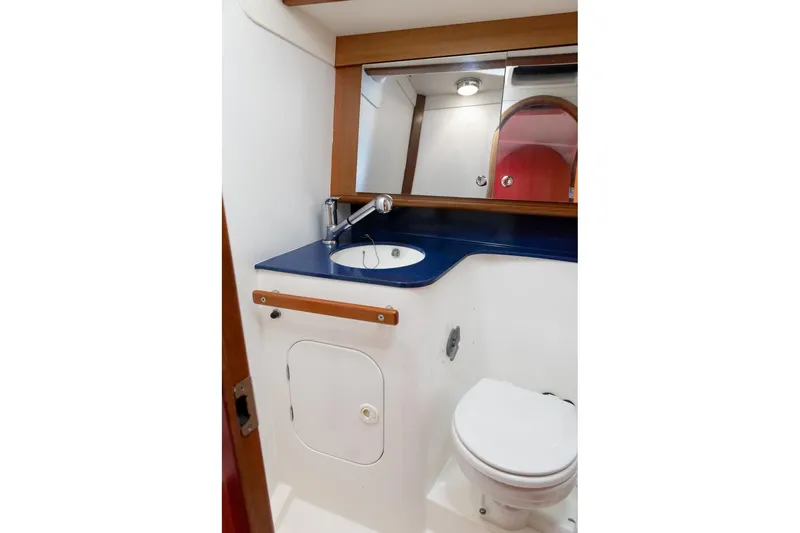 Slide: The Image of 2008 J Boats J/122 interior cabin with bed and compact sink area. - 37