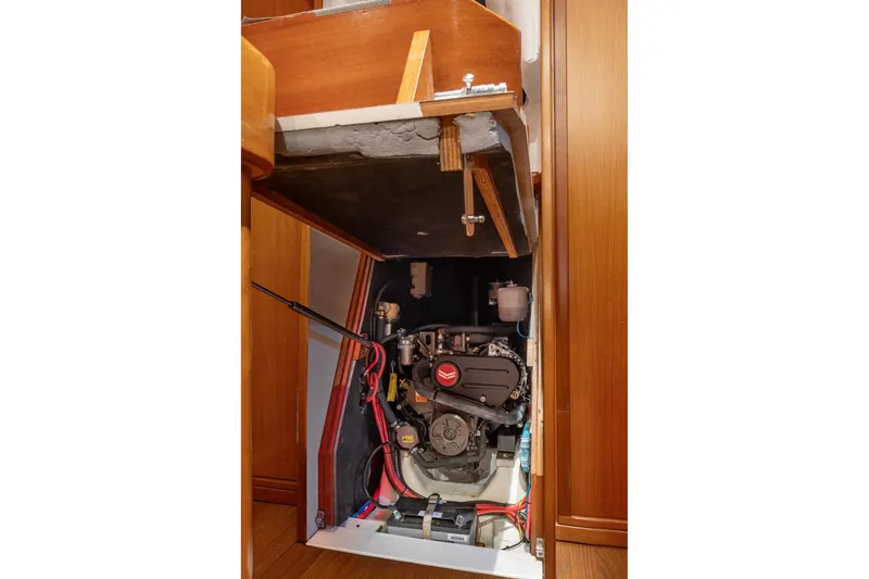 Slide: The Image of Engine compartment of 2008 J Boats J/122 sailboat, showcasing internal components and control panel. - 39
