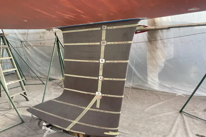 Slide: The Image of Engine compartment of a 2008 J Boats J/122 sailboat, featuring a Yanmar engine. - 41