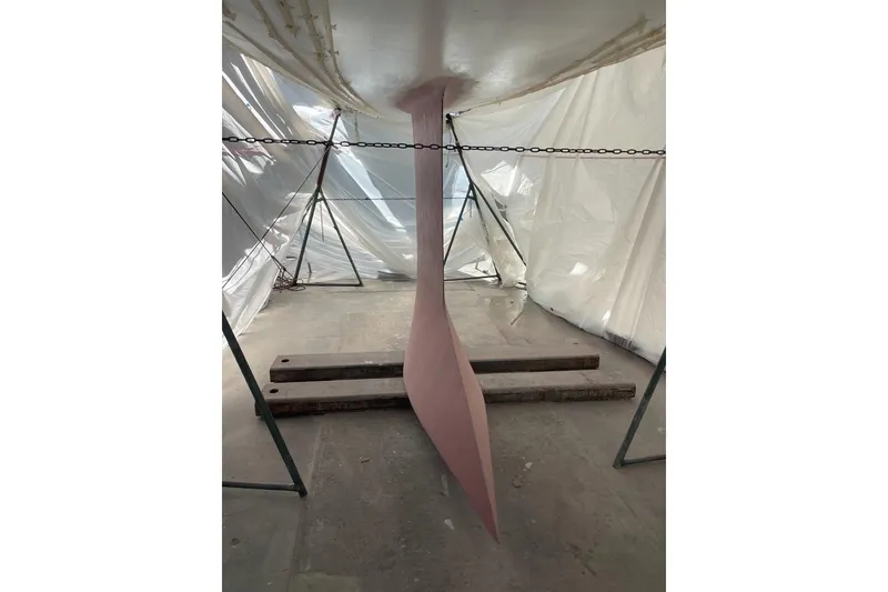Slide: The Image of Keel of 2008 J Boats J/122 sailboat under maintenance in a workshop. - 42