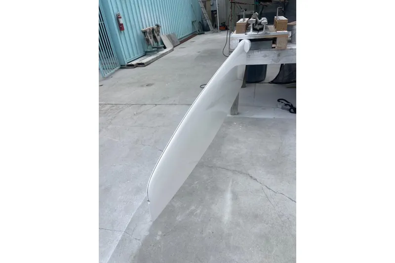 Slide: The Image of Keel of a 2008 J Boats J/122 sailboat in a covered area. - 43