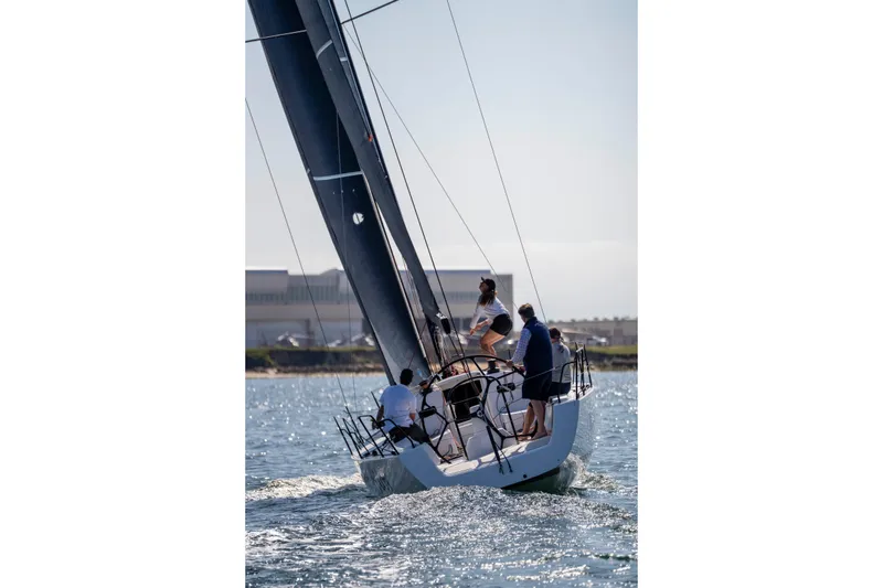 Slide: The Image of 2008 J Boats J/122 sailboat "Warrior" sailing with crew on a sunny day. - 46