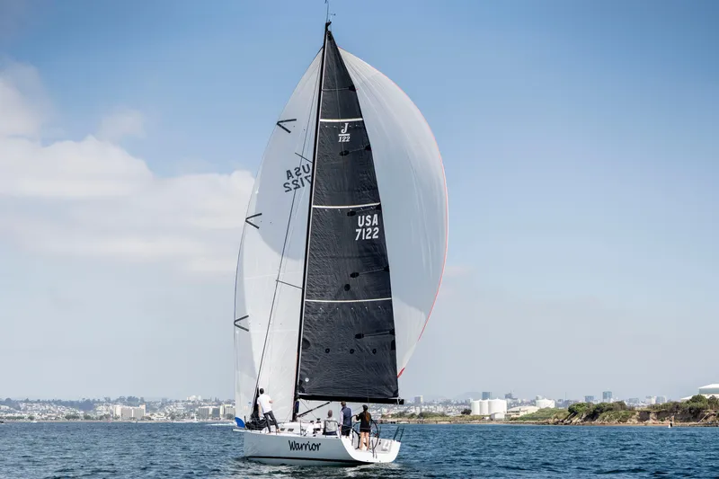 Slide: The Image of Sailing yacht J/122 from 2008 on water with city skyline in background. - 50