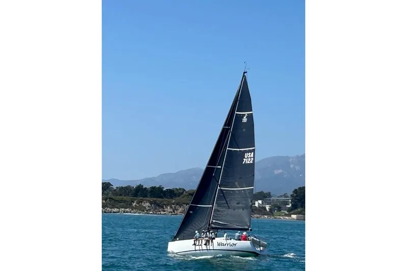 Slide: The Image of Sailing yacht J/122 from 2008 on the water with mountainous backdrop. - 55