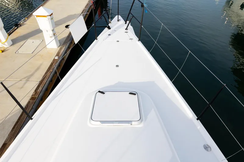 Slide: The Image of 2008 J Boats J/122 yacht deck, docked at marina, showing sleek design and hatch. - 6
