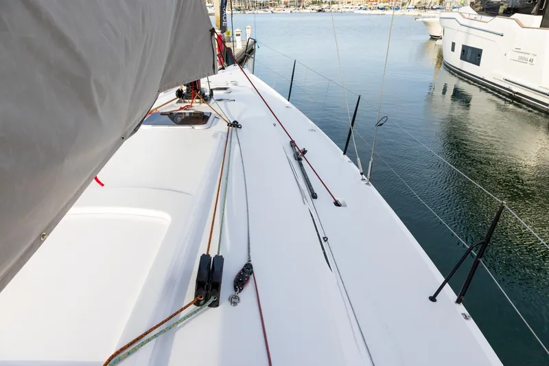 Slide: The Image of 2008 J Boats J/122 sailboat deck with rigging, docked in a marina. - 8