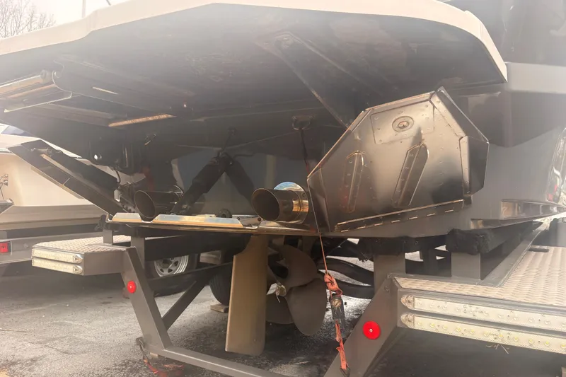Slide: The Image of Rear view of a 2019 MasterCraft XStar boat on a trailer, showing propeller and exhaust. - 14