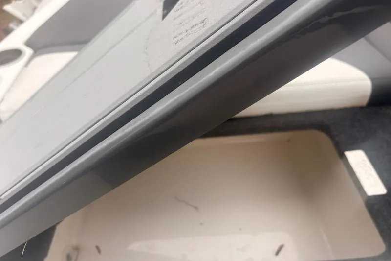 Slide: The Image of Open storage compartment in 2019 MasterCraft XStar boat interior. - 17