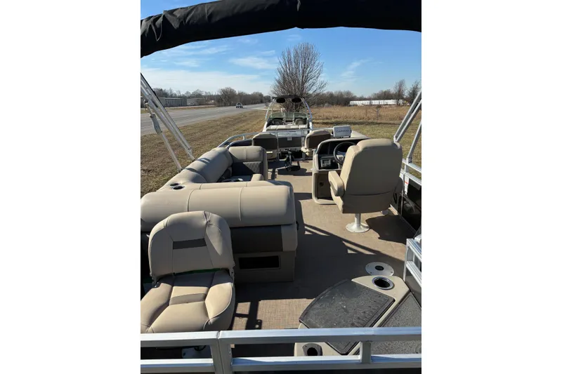 Slide: The Image of 2024 Sun Tracker Fishin' Barge 20 DLX interior with seating and steering console. - 63
