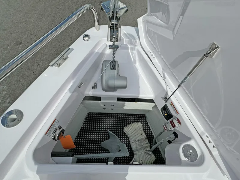 Slide: The Image of 2024 Axopar 37XC CROSS CABIN anchor storage compartment with anchor and rope. - 21