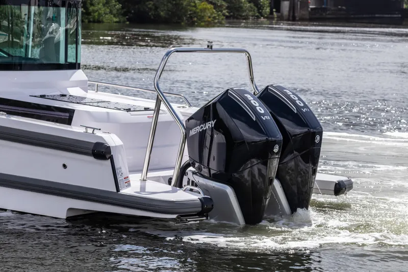 Slide: The Image of 2024 Axopar 37XC CROSS CABIN with dual Mercury 300 V8 engines on water. - 3