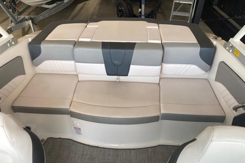 Slide: The Image of 2020 Chaparral 19 SSi boat interior with gray and white cushioned seating. - 10