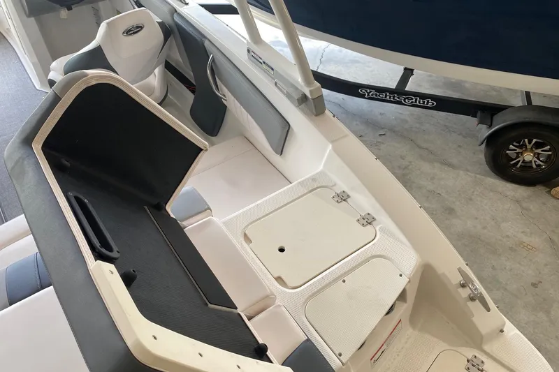 Slide: The Image of 2020 Chaparral 19 SSi boat interior with seating and storage compartments. - 12