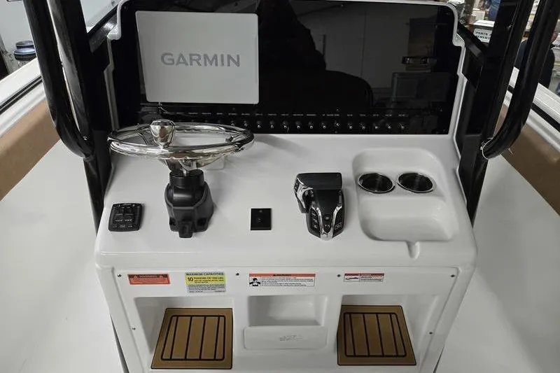 Slide: The Image of 2025 Sea Hunt Ultra 255 SE boat console with Garmin navigation system. - 7