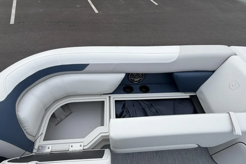 Slide: The Image of 2026 Godfrey Sweetwater 2086 C boat interior with storage compartment and seating. - 12
