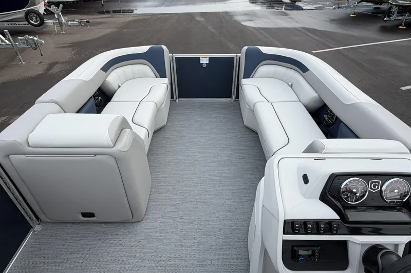 Slide: The Image of 2026 Godfrey Sweetwater 2086 C pontoon boat interior with plush seating and modern dashboard. - 13