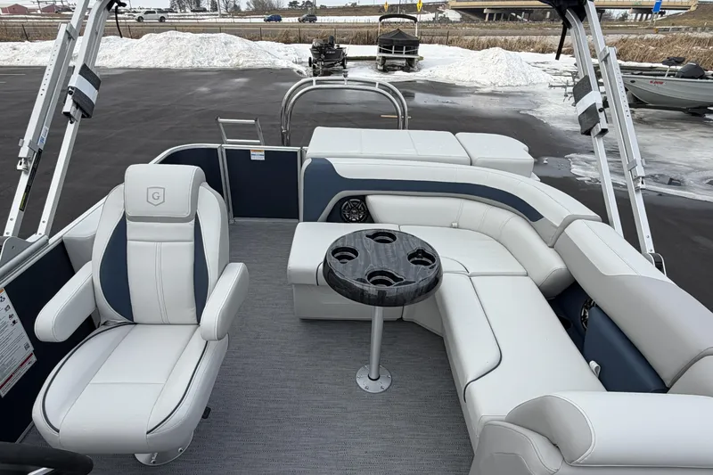 Slide: The Image of 2026 Godfrey Sweetwater 2086 C pontoon boat interior with plush seating and cup holders. - 14