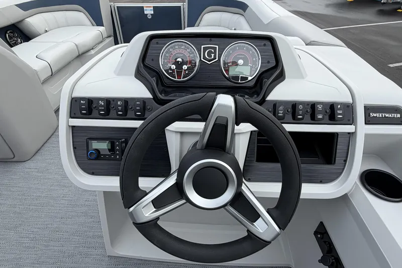 Slide: The Image of 2026 Godfrey Sweetwater 2086 C boat dashboard with steering wheel and control panel. - 17