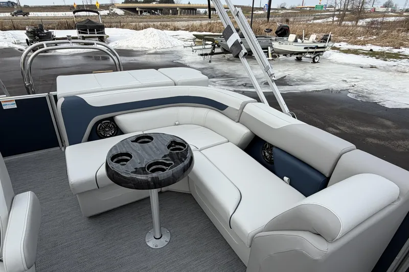 Slide: The Image of 2026 Godfrey Sweetwater 2086 C pontoon boat with plush seating and cup holders. - 18