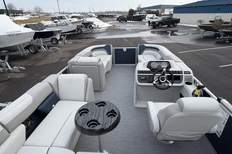 Slide: The Image of 2026 Godfrey Sweetwater 2086 C pontoon boat interior with modern seating and steering console. - 21