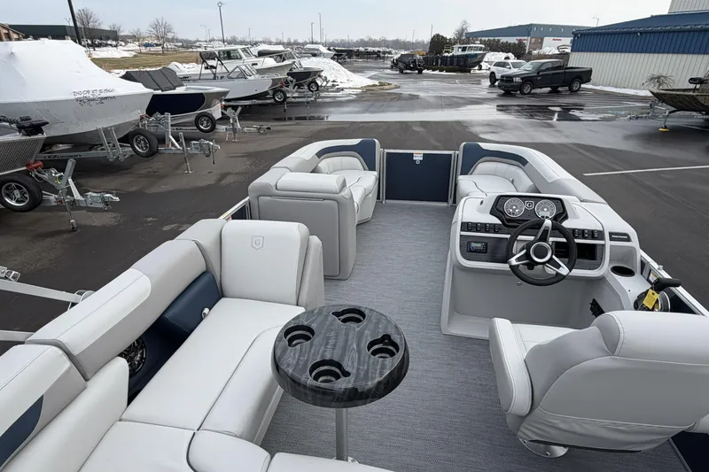 Slide: The Image of 2026 Godfrey Sweetwater 2086 C pontoon boat interior with modern seating and steering console. - 23