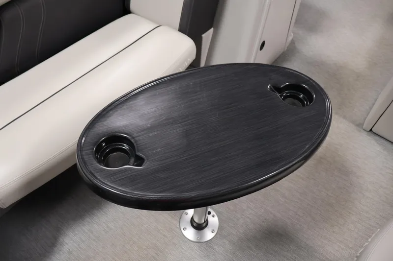 Slide: The Image of Oval table with cup holders in 2021 Sylvan 8522 Mirage boat interior. - 17