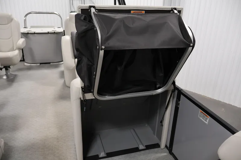 Slide: The Image of 2021 Sylvan 8522 Mirage interior with open storage compartment and seating. - 19