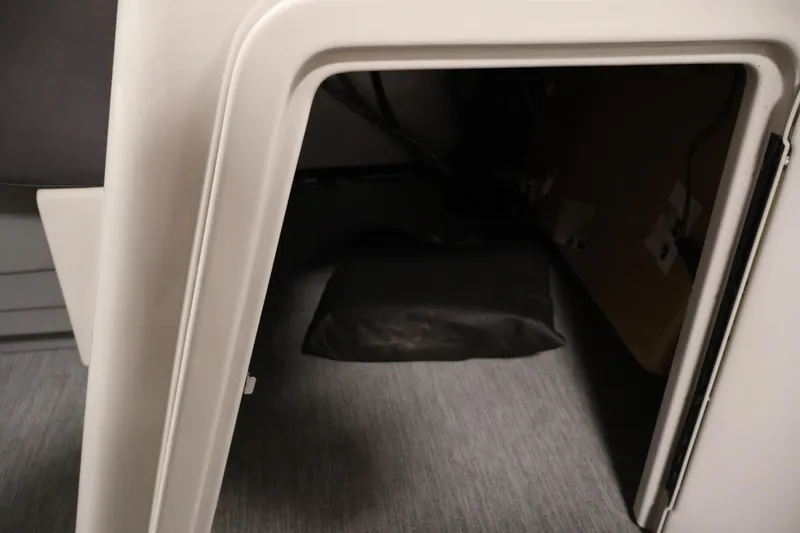 Slide: The Image of Interior storage compartment of 2021 Sylvan 8522 Mirage boat, featuring sleek design and ample space. - 21