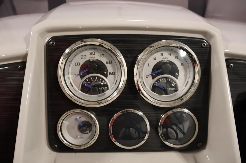 Slide: The Image of Dashboard of 2021 Sylvan 8522 Mirage boat with speedometer and fuel gauges. - 24